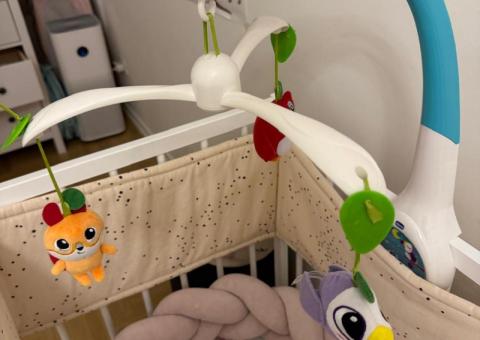 Baby items: bouncer, dress, mobile 