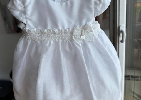 Baby items: bouncer, dress, mobile 